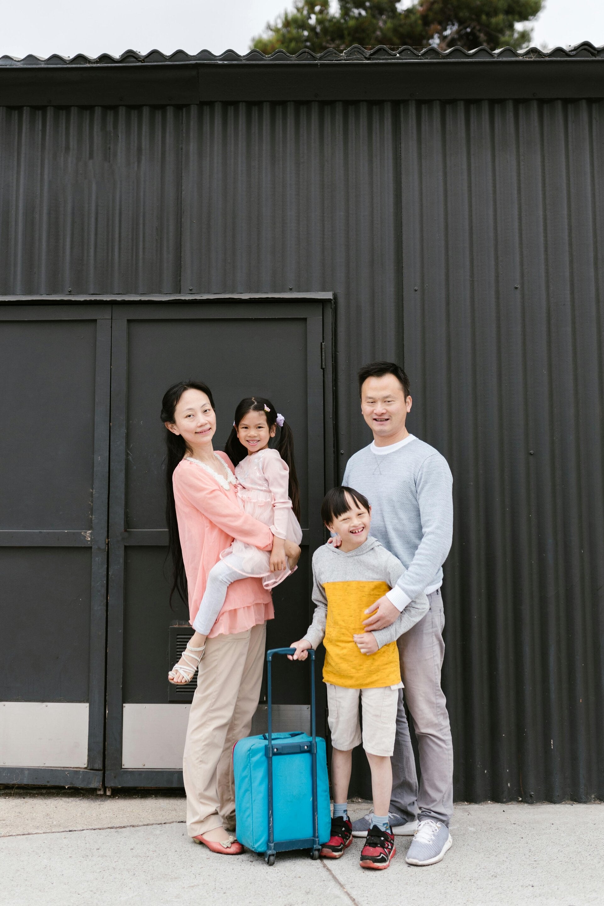 A family with their luggage ready to travel