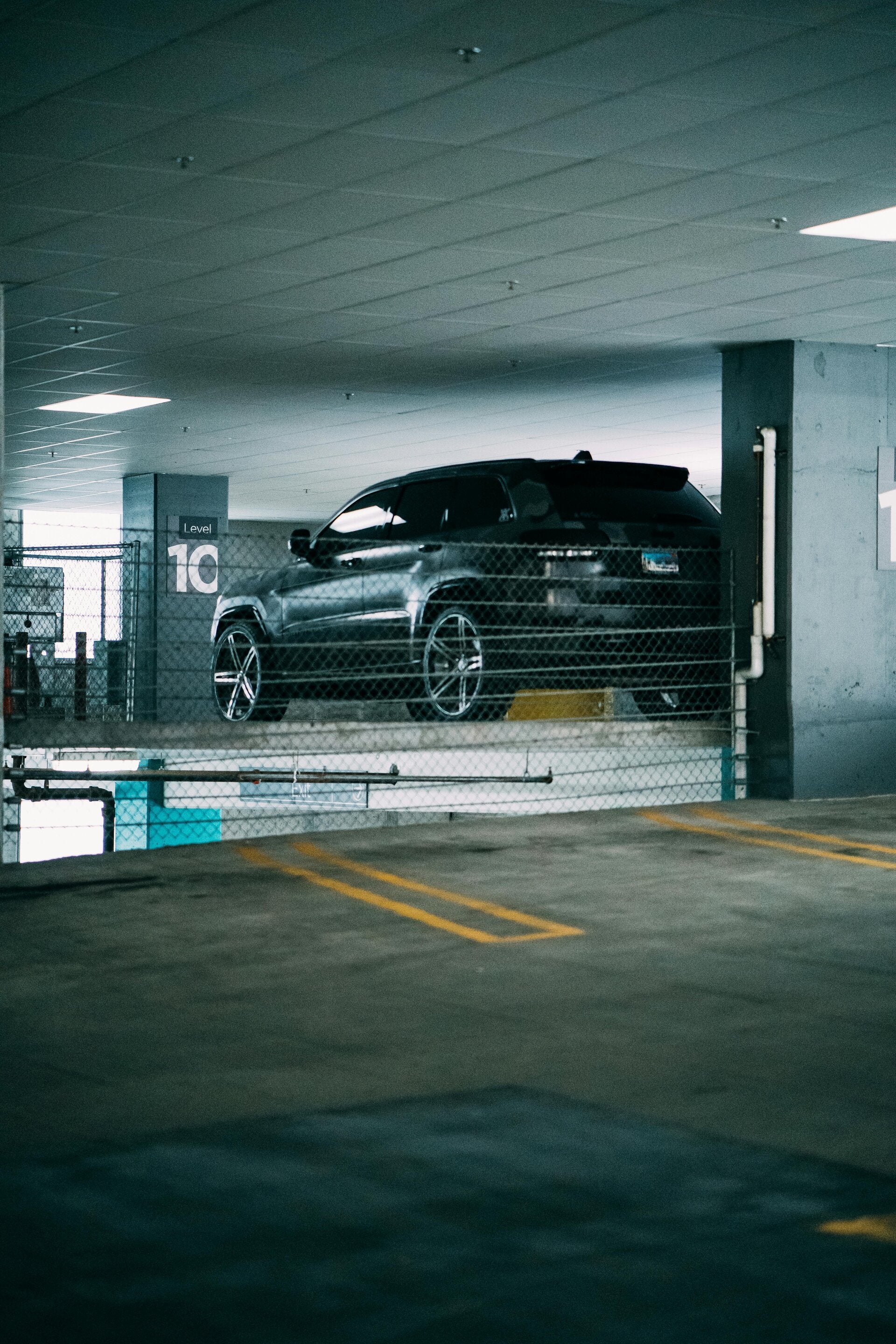 A car stored securely in a gated parking facility